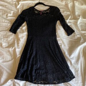Black lace dress with 3/4 sleeves.